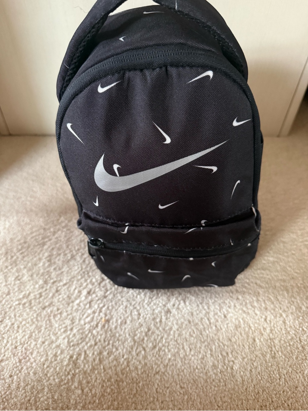 Nike Black Mini Backpack with White Swoosh Pattern